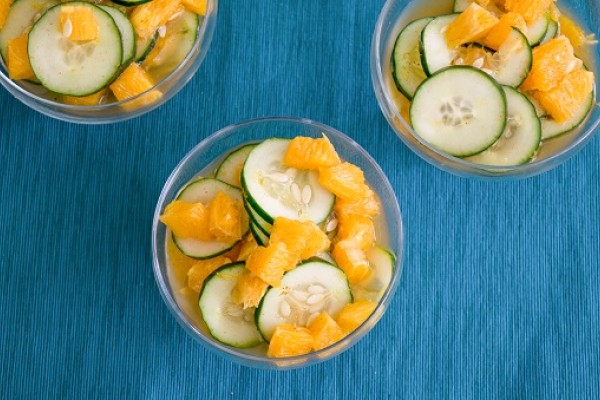 cucumber and orange salad in a bowl
