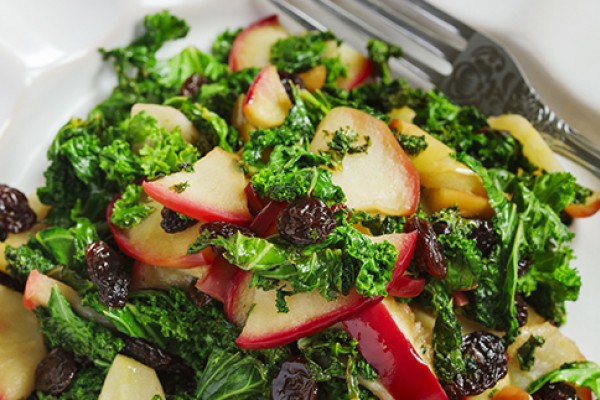 Spinach Salad with Apples and Raisins on a plate