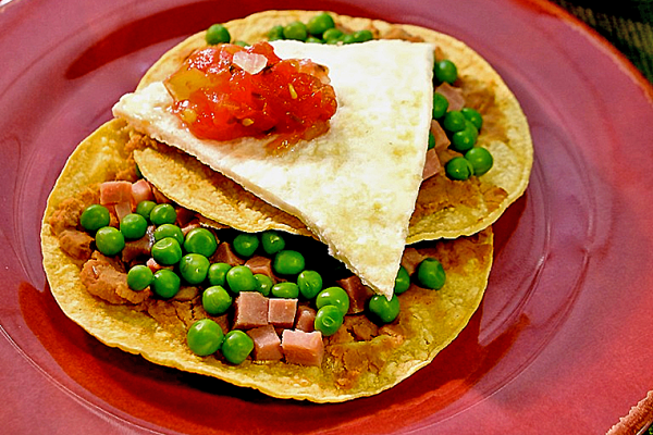 Huevos Motuleños on a plate